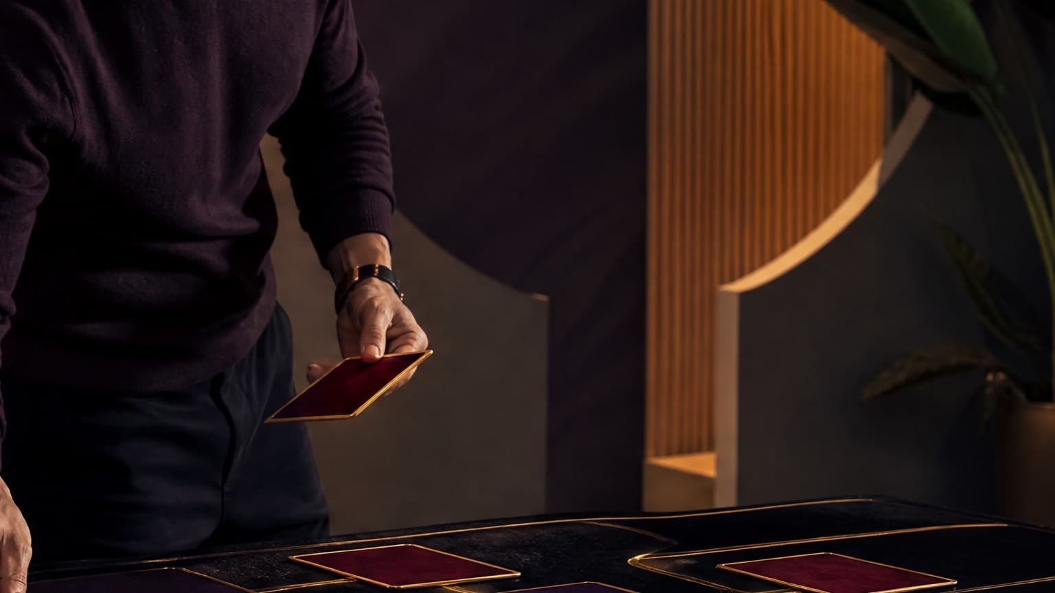 An adult reader organizing books, story cards, and a phone in a violet room, created for How to Read Web Fiction on Your Phone